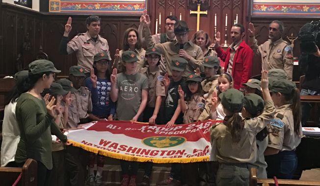Members of Scout BSA Troop 248, one of the first girls to join the Boy Scouts of America, say the organization&#x27;s pledge at their welcoming ceremony on Saturday, Feb. 2, 2019, in Washington, D.C. (Laura Kelly/The Washington Times)