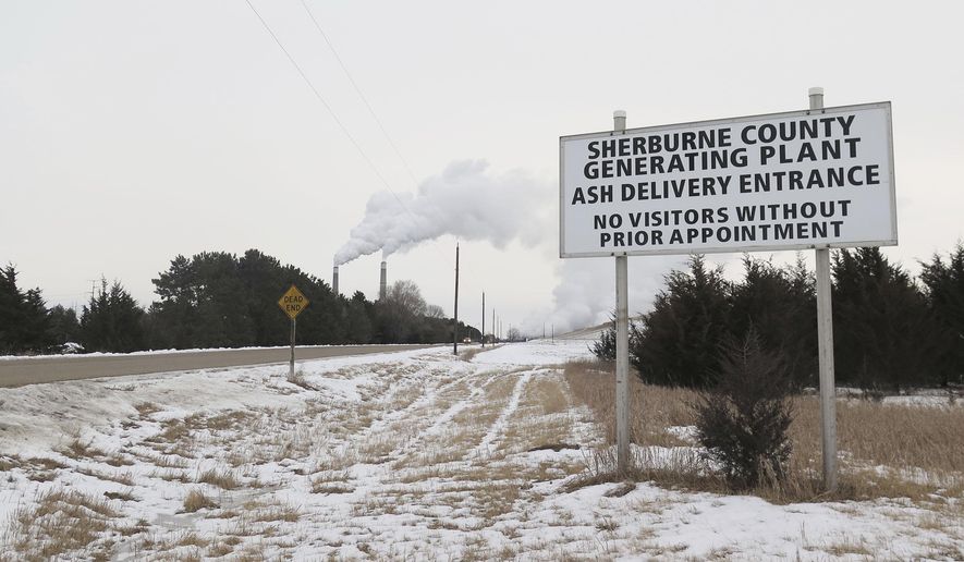 A sign marks an entrance to the Sherburne County Generating Plant, known as Sherco. Plant owner Xcel Energy plans to generate 100 percent carbon-free electricity by 2050, leaving the future of the coal-fired plant in doubt. Two of its three generators will be retired by 2026. (Kirsti Marohn/Minnesota Public Radio via AP)