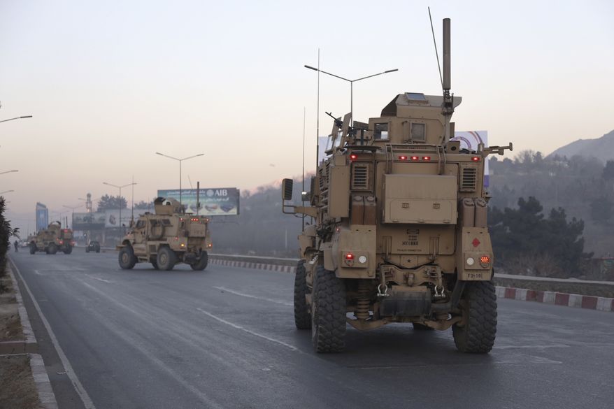 U.S forces arrive near the Intercontinental Hotel after an attack in Kabul, Afghanistan, Sunday, Jan. 21, 2018. Gunmen stormed the hotel in the Afghan capital on Saturday evening, triggering a shootout with security forces, officials said. (AP Photo/Rahmat Gul)