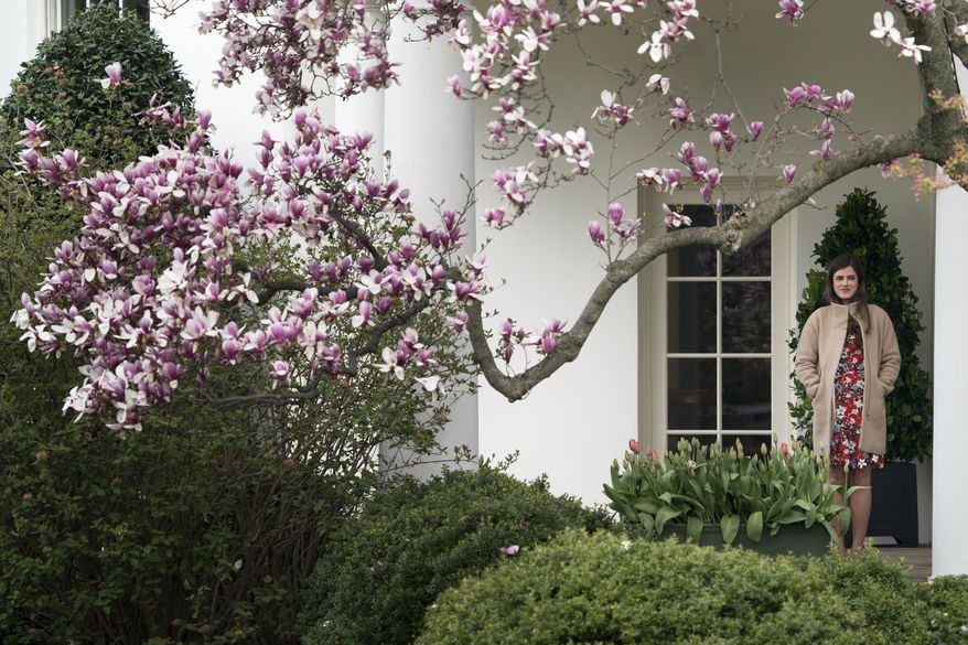 President Donald Trump's personal secretary Madeleine Westerhout stands outside the Oval Office and watches the annual White House Easter Egg Roll on the South Lawn of the White House in Washington, Monday, April 2, 2018. (AP Photo/Andrew Harnik) ** FILE **