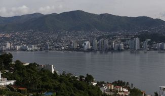 This June 20, 2018 photo, shows a view of Acapulco, Mexico. Last year, authorities opened investigations into 834 murders in Acapulco. Acapulco is in the same state where 43 students from a teacher&#39;s college disappeared in 2014 in a still unsolved case that implicates local officials, police and possibly the military.(AP Photo / Marco Ugarte)