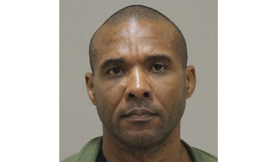 In this photo provided by the Kent County Michigan Sheriff's office, Cedric Marks is pictured in a booking photo in Grand Rapids, Mich., dated Jan. 8, 2019. The Montgomery County Texas Sheriff's Office say Marks, facing three "pending murder charges", has escaped from a private prisoner transport in Conroe, Texas, and is considered "extremely dangerous." (Kent County Michigan Sheriff's Office via AP)