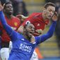 Leicester&#x27;s Ricardo Pereira, left, falls as he challenge for the ball with Manchester United&#x27;s Nemanja Matic during the English Premier League soccer match between Leicester City and Manchester United at the King Power Stadium in Leicester, England, Sunday, Feb 3, 2019. (AP Photo/Rui Vieira)