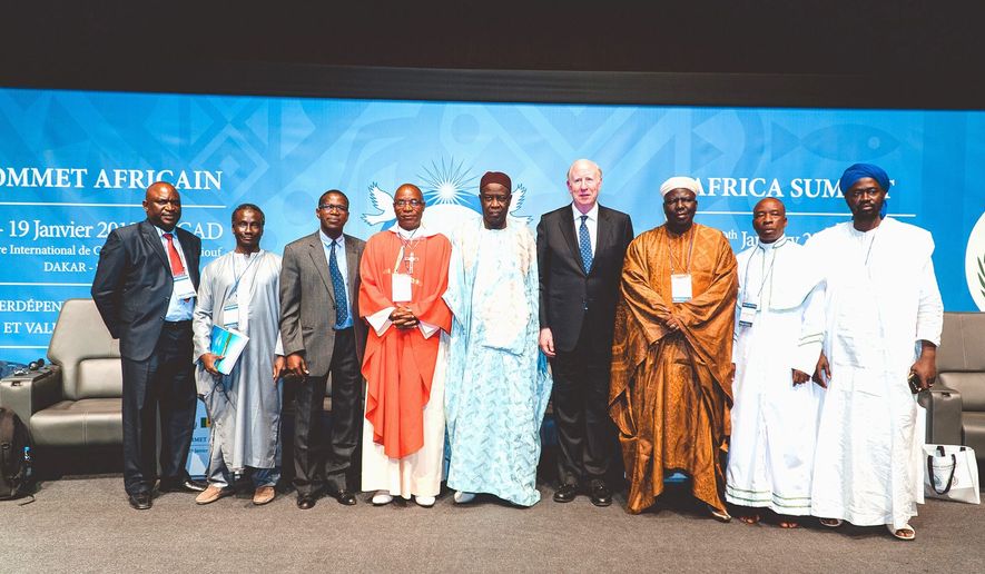 Clergy from several faiths, joined by Universal Peace Federation International Chairman Thomas G. Walsh (fourth from right), stressed interfaith cooperation as part of the solution to benefit Africa&#39;s families, communities and culture. (Photo credit: UPF-International)