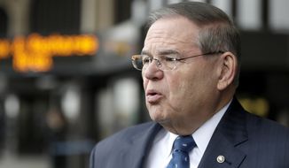 U.S. Sen. Bob Menendez is interviewed outside Newark Liberty International Airport after attending a news conference to address the partial government shutdown, which is keeping airport employees working without pay, Tuesday, Jan. 8, 2019, in Newark, N.J. (AP Photo/Julio Cortez)