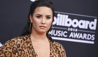 FILE - In this May 20, 2018, file photo, Demi Lovato arrives at the Billboard Music Awards at the MGM Grand Garden Arena in Las Vegas. Lovato has deleted her Twitter account following criticism that she was laughing at memes about 21 Savage. The Grammy-nominated rapper was taken into federal immigration custody in the Atlanta area early Sunday, Feb. 3, 2019. An official said the artist is a British citizen who overstayed his visa and also has a felony conviction. (Photo by Jordan Strauss/Invision/AP) ** FILE **