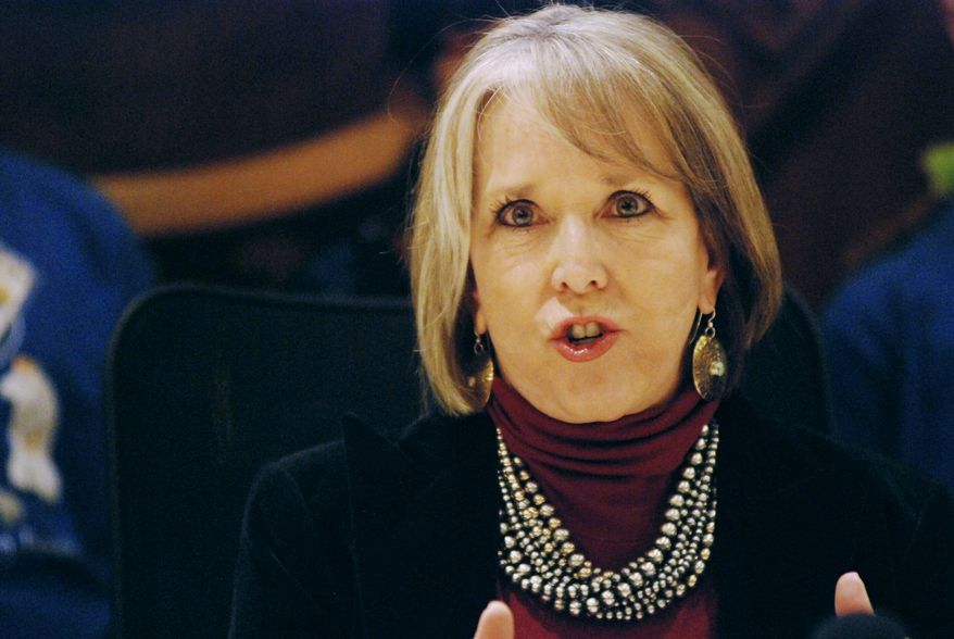 FILE - In this Tuesday, Jan. 29, 2019, file photo, New Mexico Gov. Michelle Lujan Grisham talks after signing an executive order for state agencies to aggressive pursue strategies to reduce greenhouse gas emissions in Santa Fe, N.M. Grisham ordered the withdrawal of the majority of the state's National Guard troops from the U.S. border with Mexico on Tuesday, Feb. 5, 2019, in a move that challenges President Donald Trump's description of a security crisis. (AP Photo/Morgan Lee, File)
