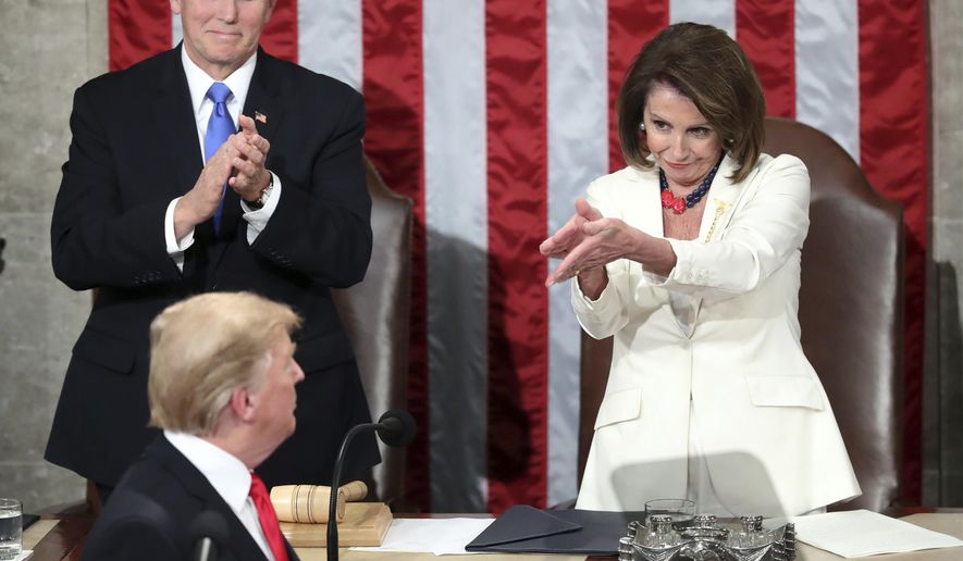 President Donald Trump turns to House speaker Nancy Pelosi of Calif., as he delivers his State of the Union address to a joint session of Congress on Capitol Hill in Washington, as Vice President Mike Pence watches, Tuesday, Feb. 5, 2019. (AP Photo/Andrew Harnik)