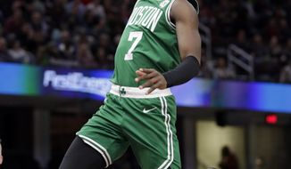 Boston Celtics&#39; Jaylen Brown (7) drives to the basket against Cleveland Cavaliers&#39; Deng Adel (32) during the first half of an NBA basketball game Tuesday, Feb. 5, 2019, in Cleveland. (AP Photo/Tony Dejak)