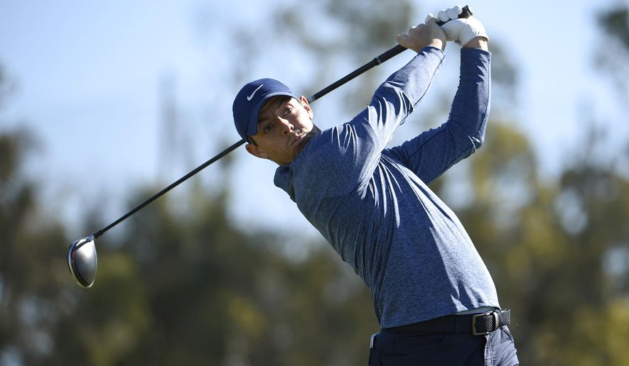 FILE - In this Jan. 25, 2019 file photo, Rory McIlroy, of Northern Ireland, hits his tee shot on the 14th hole during the second round of the Farmers Insurance Open golf tournament on the North Course at Torrey Pines in San Diego. McIlroy and NBC Sports Group launched a direct-to-consumer product Tuesday, Feb. 5 aimed at making golf more fun for fans who play. (AP Photo/Denis Poroy, File)