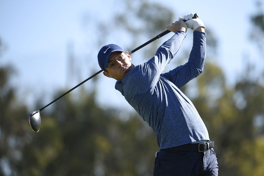 FILE - In this Jan. 25, 2019 file photo, Rory McIlroy, of Northern Ireland, hits his tee shot on the 14th hole during the second round of the Farmers Insurance Open golf tournament on the North Course at Torrey Pines in San Diego. McIlroy and NBC Sports Group launched a direct-to-consumer product Tuesday, Feb. 5 aimed at making golf more fun for fans who play. (AP Photo/Denis Poroy, File)