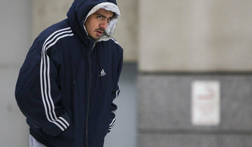 St. Louis Police Officer Nathaniel Hendren leaves the Justice Center after making bail on Thursday, Jan. 31, 2019 in St. Louis. Hendren is charged with involuntary manslaughter and armed criminal action in the Jan. 24 death of Officer Katlyn Alix. Prosecutors allege that Hendren and Alix were taking turns pointing a gun loaded with one bullet at each other and pulling the trigger. They say Alix died after being shot in the chest. (Colter Peterson/St. Louis Post-Dispatch via AP)