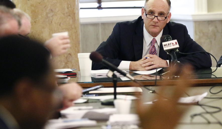 House Judiciary A Committee chairman Mark Baker, R-Brandon, background, listens as Rep. Ed Blackmon, D-Canton, foreground, argues against the Landowner Protection Act, which would reduce the liability of business owners when someone is injured on their property, during a meeting of the committee, Tuesday, Feb. 5, 2019, in Jackson, Miss. The measure passed the committee, but other representatives still wanted to talk about the bill after Baker declared it passed, and Blackmon chastised Baker for ending the meeting without being recognized for a question. (AP Photo/Rogelio V. Solis)