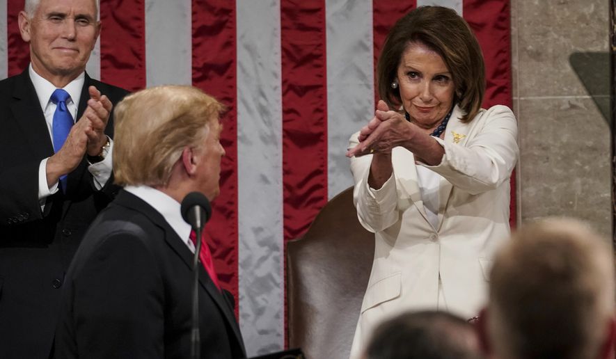 President Donald Trump turns to House Speaker Nancy Pelosi of California, as he delivers his State of the Union address to a joint session of Congress on Capitol Hill in Washington, as Vice President Mike Pence watches, Tuesday, Feb. 5, 2019. (Doug Mills/The New York Times via AP, Pool) ** FILE **