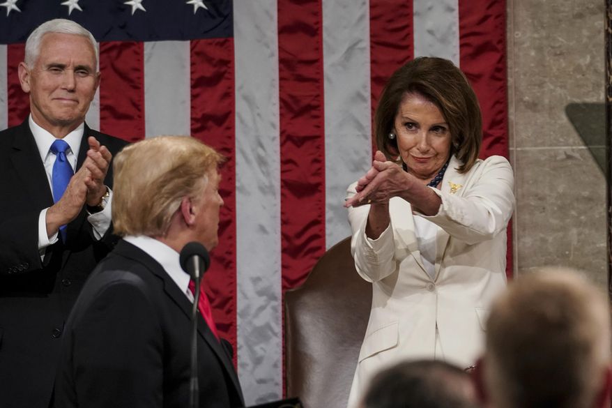 President Donald Trump turns to House Speaker Nancy Pelosi of California, as he delivers his State of the Union address to a joint session of Congress on Capitol Hill in Washington, as Vice President Mike Pence watches, Tuesday, Feb. 5, 2019. (Doug Mills/The New York Times via AP, Pool) ** FILE **