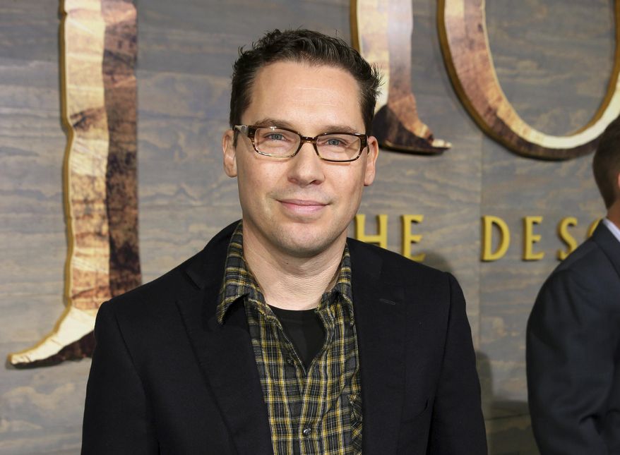 FILE - This Dec. 2, 2013 file photo shows Bryan Singer at the Los Angeles premiere of "The Hobbit: The Desolation of Smaug." The British Academy of Film and Television Arts says that it is suspending its nomination of director Bryan Singer amid accusations that he sexually assaulted minors. (Photo by Matt Sayles/Invision/AP, File)