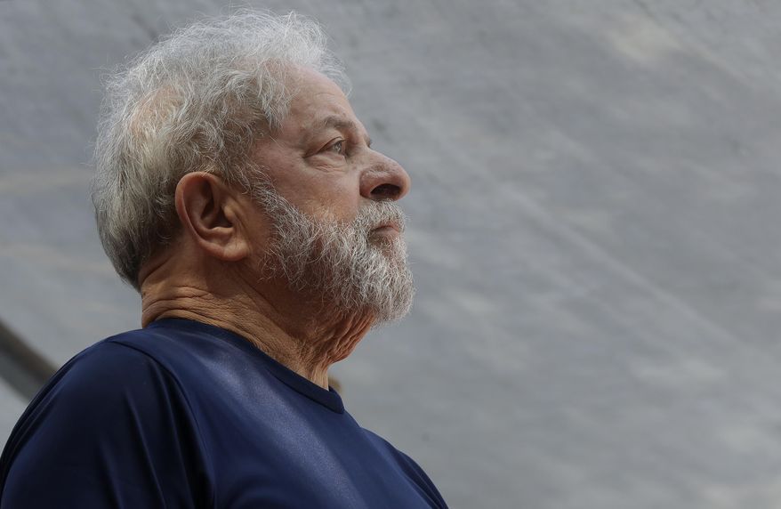 FILE - In this April 7, 2018 file photo, former Brazilian President Luiz Inacio Lula da Silva looks on before speaking to supporters outside the Metal Workers Union headquarters in Sao Bernardo do Campo, Brazil. Da Silva was sentenced to more than 12 years in prison on Feb. 6, 2019 for a second conviction of corruption and money laundering, while already serving of 12 years and 11 months. Da Silva denies guilt in both cases and is expected to appeal the latest sentence. (AP Photo/Andre Penner, File)