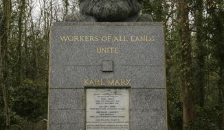 FILE - March 15, 2009 file photo of the grave of Marxist philosopher Karl Marx in Highgate Cemetery, in London. Custodians of a London cemetery say the tombstone of Communist thinker Karl Marx has been damaged in a hammer attack. The German philosopher was buried in Highgate Cemetery after his death in 1883, and his grave was later topped with a large granite bust bearing the words &amp;quot;Workers of all lands unite.&amp;quot; (Yui Mok/PA via AP)