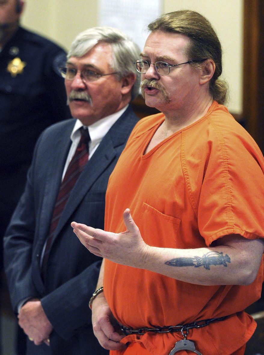 FILE - In this May 2, 2012 file photo, Ronald Allen Smith addresses the families and friends of Thomas Running Rabbit Jr. and Harvey Mad Man during a clemency hearing in Powell County District court in Deer Lodge, Mont. Smith's family tearfully pleaded with the Montana Parole Board to give clemency to a man they say has changed and deserves to live. The families of the two Blackfeet cousins killed by Smith argued the death sentence should be carried out. Smith is one of two men on death row in Montana, where the 2019 Legislature is considering bills to either revise or abolish the death penalty. (Michael Gallacher/The Missoulian via AP File)