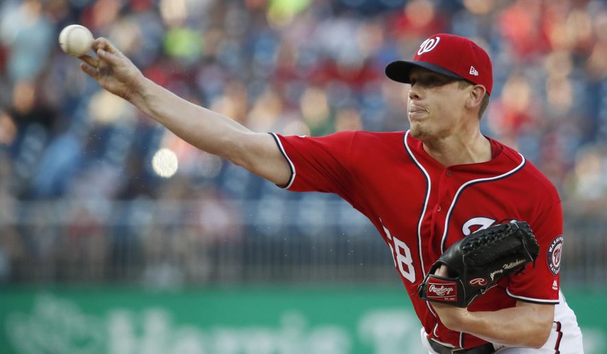 FILE - In this Saturday, Aug. 4, 2018 file photo, Washington Nationals starting pitcher Jeremy Hellickson throws during the first inning of the second baseball game of the team's doubleheader against the Cincinnati Reds at Nationals Park in Washington. A person familiar with the negotiations says that right-hander Jeremy Hellickson and the Washington Nationals have agreed in principle to a $1.3 million, one-year contract. The person spoke to The Associated Press on condition of anonymity Wednesday, Feb. 6, 2019 because the deal was subject to a successful physical exam. (AP Photo/Alex Brandon, File)