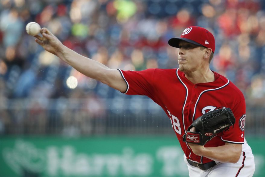FILE - In this Saturday, Aug. 4, 2018 file photo, Washington Nationals starting pitcher Jeremy Hellickson throws during the first inning of the second baseball game of the team's doubleheader against the Cincinnati Reds at Nationals Park in Washington. A person familiar with the negotiations says that right-hander Jeremy Hellickson and the Washington Nationals have agreed in principle to a $1.3 million, one-year contract. The person spoke to The Associated Press on condition of anonymity Wednesday, Feb. 6, 2019 because the deal was subject to a successful physical exam. (AP Photo/Alex Brandon, File)