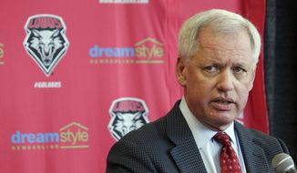 FILE - In this May 3, 2017, file photo, then-University of New Mexico athletics director Paul Krebs answers questions during a news conference in Albuquerque, N.M. Krebs has been charged with fraud and money laundering. The New Mexico Attorney General&#39;s Office filed a criminal complaint Wednesday, Feb. 6, 2019, against Krebs in connection with a 2015 golf trip to Scotland and allegations he tried to conceal a $25,000 donation. (AP Photo/Susan Montoya Bryan, File)