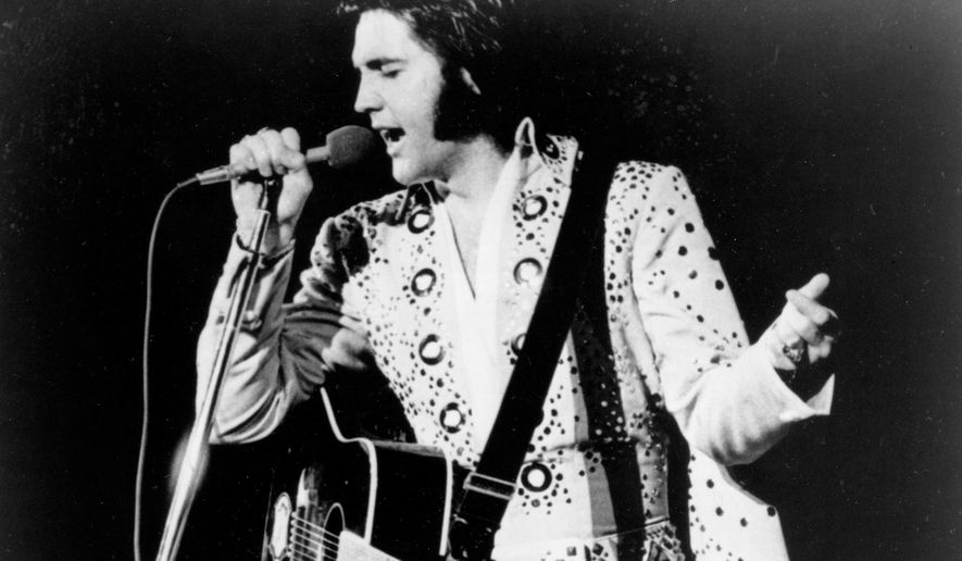 In this undated photo, Elvis Presley is shown performing at an unknown location. (AP Photo, File)