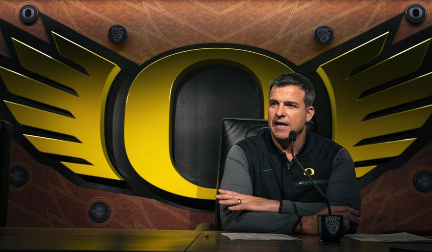 Oregon NCAA college football head coach Mario Cristobal talks to the media on signing day in Eugene, Ore. Wednesday, Feb 6, 2019. (Chris Pietsch/The Register-Guard via AP)