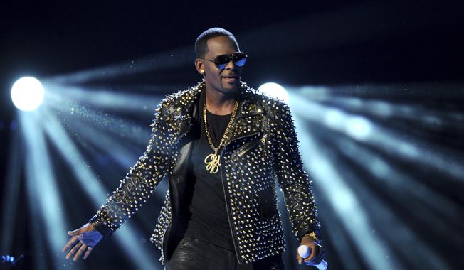 FILE - In this June 30, 2013 file photo, R. Kelly performs at the BET Awards at the Nokia Theatre in Los Angeles. R. Kelly is announcing a new tour, but it won&#x27;t be in the United States. The embattled entertainer announced on social media Tuesday, Feb. 5, 2019, that he&#x27;ll be going to Australia, New Zealand and Sri Lanka.  (Photo by Frank Micelotta/Invision/AP, File)