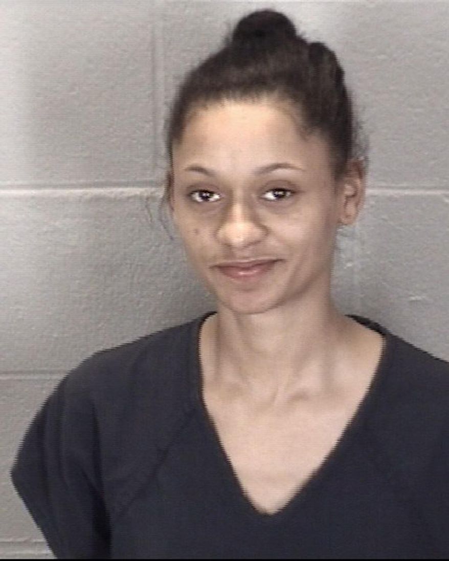 This undated booking photo released by Tippercanoe County Sheriff's Office shows Kiana Champagne Fletcher. The northwestern Indiana woman who barked at a police dog attracted the attention of officers, who arrested her on outstanding warrants. Lafayette police were conducting a traffic stop Monday, Feb. 4, 2019, when 20-year-old Fletcher began barking at a police dog sniffing the car that had been pulled over. Officers recognized Fletcher and knew she had two outstanding warrants. Police reports say Fletcher ran inside her house, but officers arrested her after obtaining a search warrant. (Tippercanoe County Sheriff's Office via AP)