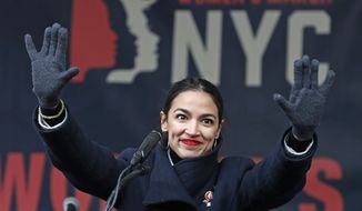 In this Jan. 19, 2019, file photo, U.S. Rep. Alexandria Ocasio-Cortez, (D-New York) waves to the crowd after speaking at Women&#x27;s Unity Rally in Lower Manhattan in New York. Democrats including Ocasio-Cortez of New York and veteran Sen. Ed Markey of Mass. are calling for a Green New Deal intended to transform the U.S. economy to combat climate change and create jobs in renewable energy. (AP Photo/Kathy Willens, File) **FILE**