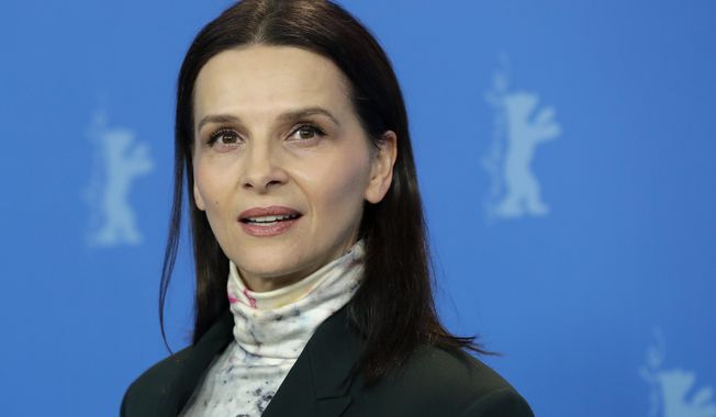 Jury president Juliette Binoche poses for the photographers during a photo call at the 2019 Berlinale Film Festival in Berlin, Germany, Thursday, Feb. 7, 2019. (AP Photo/Michael Sohn)