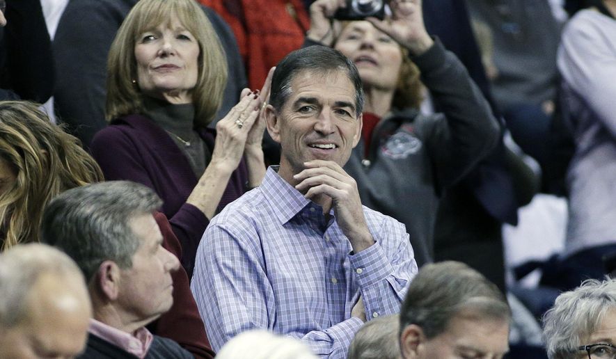 In this Dec. 7, 2016, file photo, retired NBA player and Gonzaga alumnus John Stockton, center, looks on before an NCAA college basketball game between Gonzaga and Washington in Spokane, Wash. John Stockton is the father of Gonzaga women&#39;s basketball player Laura Stockton. (AP Photo/Young Kwak, File) **FILE**