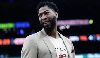 FILE - In this Feb. 2, 2019, file photo, New Orleans Pelicans forward Anthony Davis (23) smiles during the second half of an NBA basketball game against the San Antonio Spurs, in San Antonio. Only a few hours remain to determine if the Anthony Davis saga ends for this season or lingers into the summer. The NBA trade deadline is Thursday, Feb. 7, 2019, at 3 p.m. EST, and Davis is still seeking a trade from the New Orleans Pelicans.(AP Photo/Eric Gay, File)