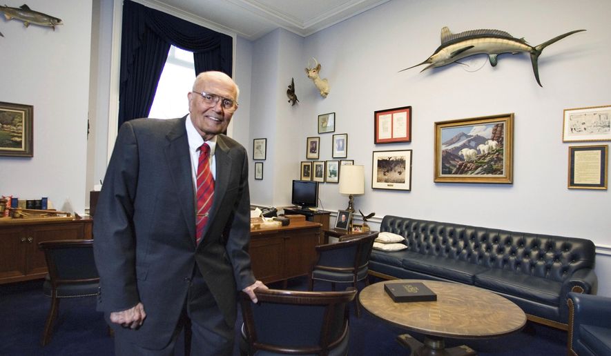 In a Feb. 4, 2009, file photo, Rep. John Dingell, D-Mich. poses for a photograph inside his office in House Rayburn Office Building on Capitol Hill in Washington. Dingell, the longest-serving member of Congress in American history who mastered legislative deal-making and was fiercely protective of Detroit&#39;s auto industry, has died at age 92. Dingell, who served in the U.S. House for 59 years before retiring in 2014, died Thursday, Feb. 7, 2019, at his home in Dearborn, said his wife, Congresswoman Debbie Dingell. (AP Photo/Manuel Balce Ceneta, File)