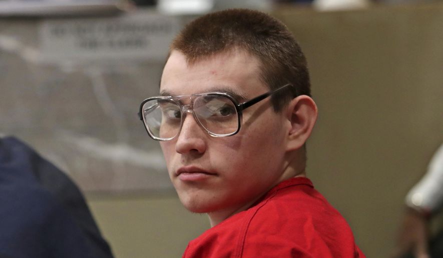 FILE - In this Jan. 16, 2019, file photo, Parkland school shooting suspect Nikolas Cruz sits during a status hearing at the Broward Courthouse in Fort Lauderdale, Fla. The potential death penalty murder case against Cruz is moving slowly and could take years. (John McCall/South Florida Sun-Sentinel via AP, Pool, File)