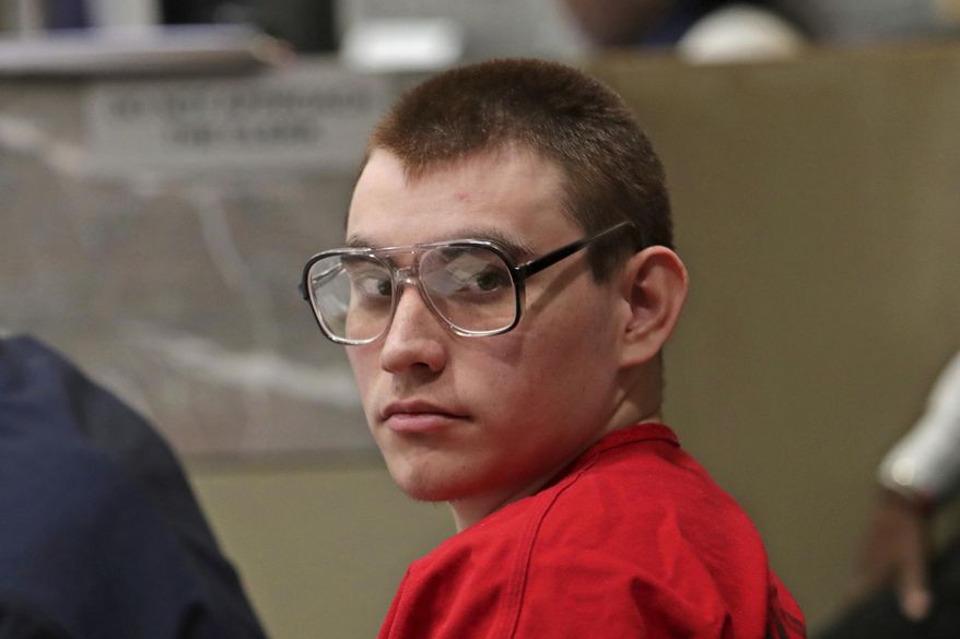 FILE - In this Jan. 16, 2019, file photo, Parkland school shooting suspect Nikolas Cruz sits during a status hearing at the Broward Courthouse in Fort Lauderdale, Fla. The potential death penalty murder case against Cruz is moving slowly and could take years. (John McCall/South Florida Sun-Sentinel via AP, Pool, File)