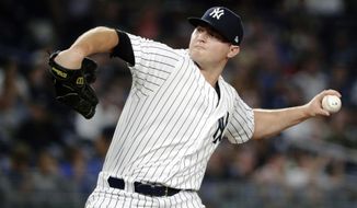 FILE - In this July 26, 2018, file photo, New York Yankees&#x27; Zach Britton delivers a pitch during the eighth inning of a baseball game against the Kansas City Royals, in New York. Zack Britton will be a different pitcher for the New York Yankees this year _ at least in name. Known throughout his baseball career as Zach, the 31-year-old reliever said Thursday, Feb. 7, 2019, going forward his name should be spelled Zack.(AP Photo/Frank Franklin II, File)
