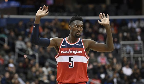 Washington Wizards forward Bobby Portis gestures during the second half of the team&#39;s NBA basketball game against the Cleveland Cavaliers, Friday, Feb. 8, 2019, in Washington. The Wizards won 119-106. (AP Photo/Nick Wass)