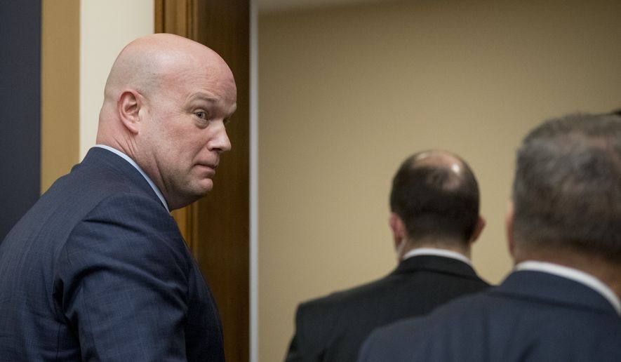Acting Attorney General Matthew Whitaker departs after testifying before the House Judiciary Committee on Capitol Hill, Friday, Feb. 8, 2019, in Washington. Democrats pressed him on his interactions with President Donald Trump and his oversight of the special counsel&#39;s Russia investigation. (AP Photo/Andrew Harnik)