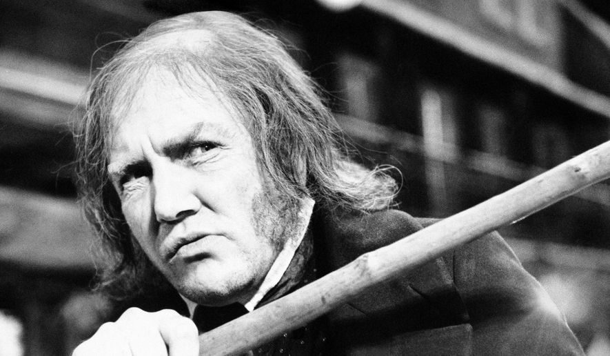 In this Jan. 15, 1970, file photo, British actor Albert Finney waves his cane while playing the title role in &amp;quot;Scrooge,&amp;quot; at Shepperton Studios. British Actor Albert Finney, the Academy Award-nominated star of films from &amp;quot;Tom Jones&amp;quot; to &amp;quot;Skyfall&amp;quot; has died at the age of 82 his family said on Friday, Feb. 8, 2019. (AP Photo/R. Dear, File)