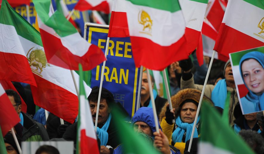 Supporters of Maryam Rajavi, the leader of the National Council of Resistance of Iran, demonstrate in Paris, Friday, Feb. 8, 2019, as Iran marks the 40th anniversary of its Islamic Revolution. (AP Photo/Francois Mori) ** FILE **