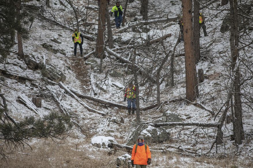 Searchers comb the area near the Black Hills Children's Home near Rockerville, S.D., on Tuesday, Feb. 5, 2019, while looking for Serenity Dennard, a 9-year-old girl who was last seen Sunday morning leaving the Children's Home. Officials are encouraging anyone living in the Rockerville, Foster Gulch and Highway 16 area to check their property. (Ryan Hermens/Rapid City Journal via AP)