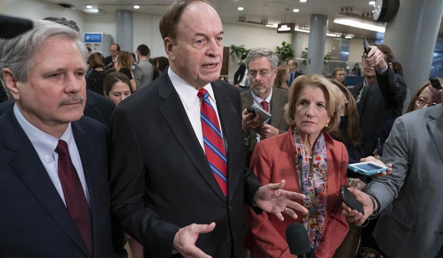 In this Feb. 6, 2019, photo, Sen. Richard Shelby, R-Ala., the top Republican on the bipartisan group bargainers working to craft a border security compromise in hope of avoiding another government shutdown, is joined by Sen. John Hoeven, R-N.D., left, and Sen. Shelley Moore Capito, R-W.Va., right, as they speak with reporters in Washington. Congressional bargainers seem close to clinching a border security agreement that would avert a fresh government shutdown, with leaders of both parties voicing optimism and the top GOP negotiator saying he believes President Donald Trump would back the emerging accord. (AP Photo/J. Scott Applewhite)