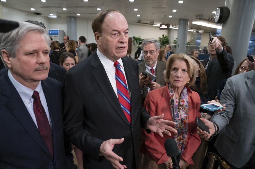In this Feb. 6, 2019, photo, Sen. Richard Shelby, R-Ala., the top Republican on the bipartisan group bargainers working to craft a border security compromise in hope of avoiding another government shutdown, is joined by Sen. John Hoeven, R-N.D., left, and Sen. Shelley Moore Capito, R-W.Va., right, as they speak with reporters in Washington. Congressional bargainers seem close to clinching a border security agreement that would avert a fresh government shutdown, with leaders of both parties voicing optimism and the top GOP negotiator saying he believes President Donald Trump would back the emerging accord. (AP Photo/J. Scott Applewhite)