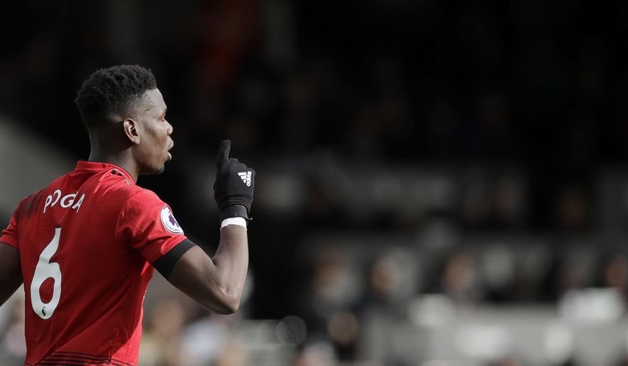 Manchester United&#39;s Paul Pogba celebrates after scoring his side&#39;s third goal from penalty during the English Premier League soccer match between Fulham and Manchester United at Craven Cottage stadium in London, Saturday, Feb. 9, 2019. (AP Photo/Matt Dunham)