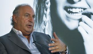 FILE - In this file photo dated Wednesday, June 5, 2013, Philip Green speaks during an interview at his new Topshop store in Hong Kong. A British newspaper has published Saturday Feb. 9, 2019, details of allegations of sexual and racial misconduct by retail tycoon Philip Green, after the Topshop owner dropped a legal bid to stop the claims being reported.(AP Photo/Kin Cheung, FILE)