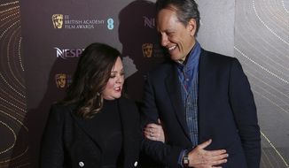 Actors Melissa McCarthy, left, and Richard E. Grant pose for photographers upon arrival at the BAFTA Nominees Party in London, Saturday, Feb. 9, 2019. (Photo by Joel C Ryan/Invision/AP)