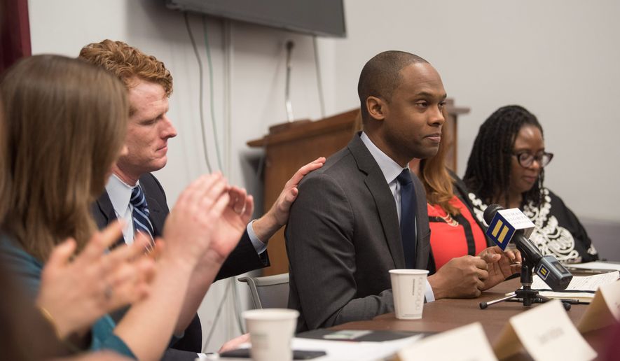J.R. Ford, a parent of a transgender young person, is comforted by Rep. Joe Kennedy, D-Mass. after speaking about the need for the Equality Act, a comprehensive LGBTQ nondiscrimination bill, at a roundtable hosted by the Human Rights Campaign's Parents for Transgender Equality National Council at the Cannon House Office Building on Wednesday, Jan. 30, 2019, in Washington. (Kevin Wolf/AP Images for Human Rights Campaign) ** FILE **