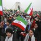 Children wave Iranian flags during a ceremony celebrating the 40th anniversary of the Islamic Revolution, at the Azadi, Freedom, Square in Tehran, Iran, Monday, Feb. 11, 2019. Hundreds of thousands of people poured out onto the streets of Tehran and other cities and towns across Iran, marking the date 40 years ago that is considered victory day in the country&#39;s 1979 Islamic Revolution. (AP Photo/Vahid Salemi)